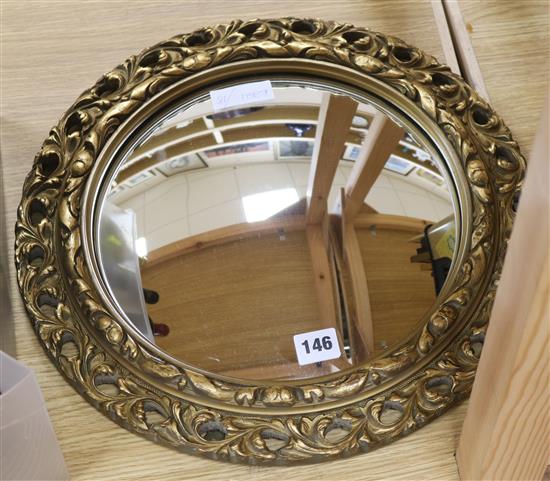 A gilt circular mirror